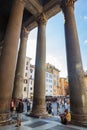 Tourist explore the Pantheon, located at Piazza della Rotonda, on a cloudless summer day