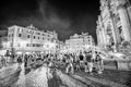 ROME, ITALY - JUNE 2014: Tourists enjoy the beautiful Trevi Fountain on a summer night Royalty Free Stock Photo
