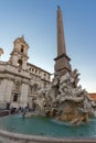 Tourists are strolling at the sunset in a Piazza Navona in city of Rome, Italy