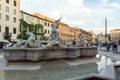 Tourists are strolling at the sunset in a Piazza Navona in city of Rome, Italy