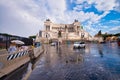 ROME, ITALY - JUNE 2014: Tourists visit Venice Square at dusk. The city attracts 15 million people annually