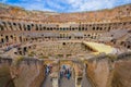 ROME, ITALY - JUNE 13, 2015: Tourists visiting the Roman Coliseum, inside view from the enter to the top Royalty Free Stock Photo