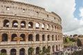 ancient Colosseum ruins with crowded square
