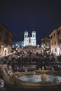 crowded tourists near Fontana della Barcaccia (fountain of the boat) and on staircase at night Royalty Free Stock Photo