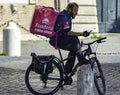 Foodora food delivery service biker on hurry to customers