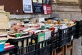 Rome, Italy - March 17th, 2022. Bookstore selling different books in plastic boxes on the street