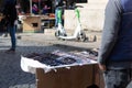 Rome, Italy - March 17th, 2022. Man selling sunglasses at a stall on the streets of Rome, Italy