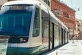 Electric tram for public transport in the historic center of Rome in Italy. Perspective in the outdoor