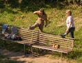 Group of masked and unmasked elderly people doing gymnastics on a lawn in Rome during self-isolation