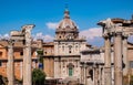 Santi Luca and Martina church with temple of Saturn, Vespasian and Titus and Septimius Severus Arch at Roman Forum in Rome, Italy Royalty Free Stock Photo