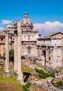 Santi Luca and Martina church with temple of Vespasian and Titus and Septimius Severus Arch at Roman Forum in Rome in Italy Royalty Free Stock Photo