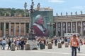 St Peter\'s courtyard with crowd of tourists and large banner of Pope Paul 11 in year of his beatification.Rome Royalty Free Stock Photo