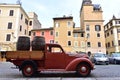 Vintage italian red car camper Fiat 1100 ELR pick-up, Rome