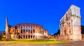 Rome, Italy: Night view of The Arch of Constantine next to the Colosseum after sunset over a blue sky