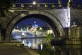 Rome. Italy. Night view of the city in the illumination from under the bridge over the Tiber River Royalty Free Stock Photo
