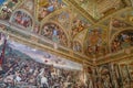 Rome, Italy - 27 Nov, 2022: Frescoes in the wall and ceiling of one of the Rafael Rooms in the Vatican Museums