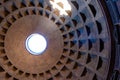 The famous cassette ceiling dome of Pantheon temple of all the gods with wide open rotunda on the top. Sunlight rays penetrating Royalty Free Stock Photo