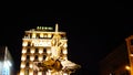 Night long exposition of the triton of the homonymous fountain and the Bernini hotel in Rome