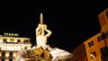 Night long exposition of the triton of the homonymous fountain and the Bernini hotel in Rome