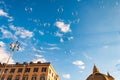 Soap bubbles flying on Piazza del Popolo, People Square in Rome surrounded by ancient churches like Santa Maria in Montesanto with Royalty Free Stock Photo