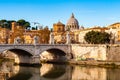 Tiber river streams, Ponte Vittorio Emanuele II bridge, flying seagulls and Rome cityscape view with St. Peter dome on the Royalty Free Stock Photo