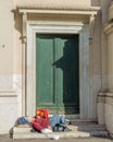 Homeless people often rest on the steps of the Church of San Rocco in Rome