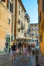 Tourists walk on Via Giustiniani