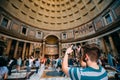 Rome, Italy. Man Tourist Taking Photo On Smartphone Interior Of Pantheon.