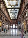 Rome, Italy - October 3, 2023: People going at the famous glass roof Galleria Alberto Sordi, the oldest shopping center