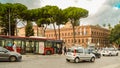 ROME, ITALY - OCTOBER 07, 2018: Red passenger bus and passenger car transport on Rome street in the central part of the Royalty Free Stock Photo
