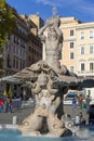 17th century Fontana del Tritone (Triton Fountain) with dolphins heads, located in the Piazza Barberini, Rome, Italy