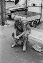 Rome, Italy, 1970 - An old lady thoughtfully unties the knots of a string