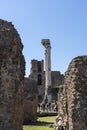 Among the remains of dilapidated buildings are the pillars of Il Tempio dei Dioscuri in Rome Royalty Free Stock Photo