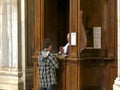 ROME, ITALY- SEPTEMBER 30, 2015: boy performing catholic confession at the basilica santa maria maggiore, rome