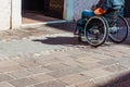 Rome, italy - september 22, 2021: A person in a wheelchair faces a step at the entrance of an unadapted building