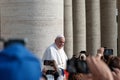 Pope Francis greets Catholics at a weekly audience