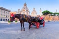 ROME, ITALY - September 12, 2016: Roman carts Carriage with red wheels, waiting for tourists on Piazza Foro Traiano in Rome Royalty Free Stock Photo