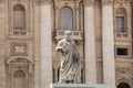 Rome, Italy - September 13, 2017: The statue of St. Peter, who holds the key to heaven. St. Peter`s Basilica in the background. Royalty Free Stock Photo