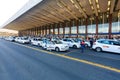 Rome, Italy - September 15, 2016: Taxi near the taxi stop and queue from people at entrance of Termini Train Station in Rome