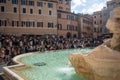Trevi fountain with large group of tourists