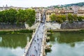 View of people walk on St Angel Bridge from Castel Sant`Angelo in Rome city