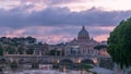 Rome, Italy: St. Peter's Basilica, Saint Angelo Bridge and Tiber River after the sunset day to night timelapse Royalty Free Stock Photo