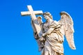 Statue of an Angel with the Cross on Sant`Angelo Bridge in Rome, Italy Royalty Free Stock Photo