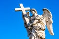 Statue of an Angel with the Cross on Sant'Angelo Bridge in Rome, Italy Royalty Free Stock Photo