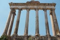 Rome, Italy - Temple of Saturn columns at the Roman Forum. Heart of Ancient Rome. Roman Empire political center ruins. Royalty Free Stock Photo