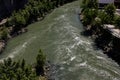 The Tiber River runs through the city of Rome. The waterfalls of the river refresh the seagulls.