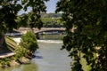 The Tiber River runs through the city of Rome. The waterfalls of the river refresh the seagulls.