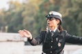 Rome, Italy - 29.10.2019: Woman police officer in uniform regulates traffic