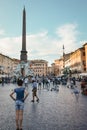 Rome, Italy - Woman standing in crowded Piazza Navona, public open space famous for Fountain of Four Rivers.