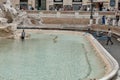 Rome, Italy, Workers collect coins in the Trevi Fountain in the early morning